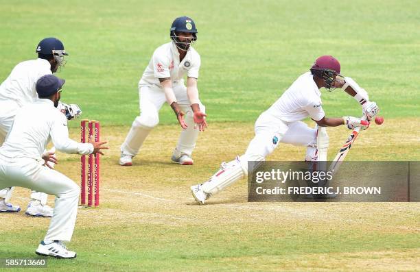 Shane Dowrich of the West Indies is bowled out an an LBW from bowler Amit Mishra of India on day five of their Second Test cricket match on August 3,...