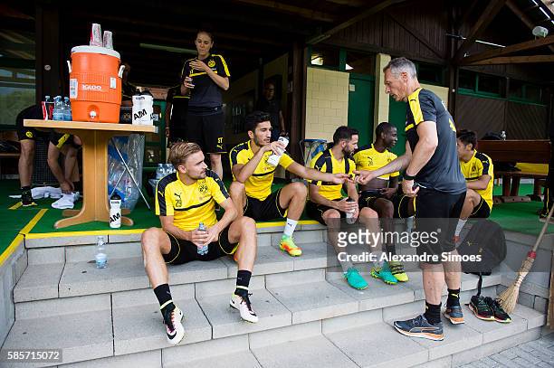 Marcel Schmelzer, Nuri Sahin with Rainer Schrey of Borussia Dortmund during a training session on the training ground of Bad Ragaz during Borussia...