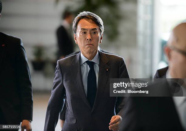Nobuteru Ishihara, economy minister for Japan, arrives at the official residence of Japan's Prime Minister Shinzo Abe, not pictured, in Tokyo, Japan,...