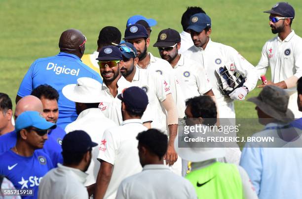 Players from India and the West Indies congratulate one another at the end of their match on day five of their Second Test cricket match on August 3,...