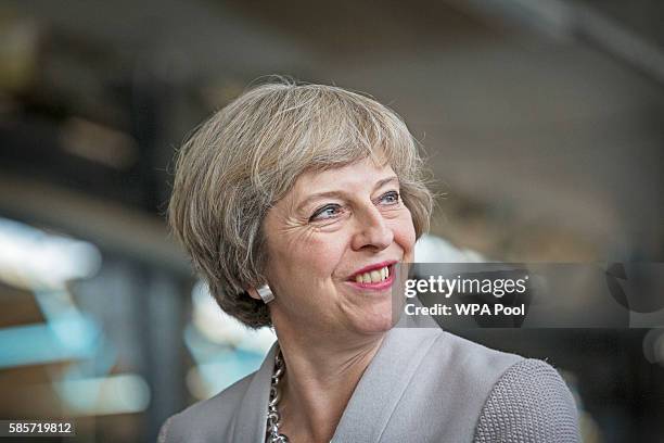 British Prime Minister Theresa May visits Martinek joinery factory on August 3, 2016 in London, United Kingdom.