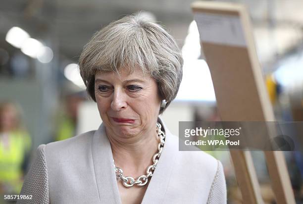 British Prime Minister Theresa May visits Martinek joinery factory on August 3, 2016 in London, United Kingdom.