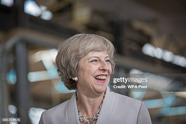 British Prime Minister Theresa May visits Martinek joinery factory on August 3, 2016 in London, United Kingdom.