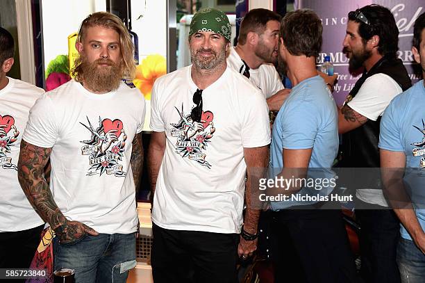 Josh Mario John and Scott Patterson attend the Kiehl's national LifeRide for amfAR celebration at the NYC flagship store on August 3, 2016 in New...
