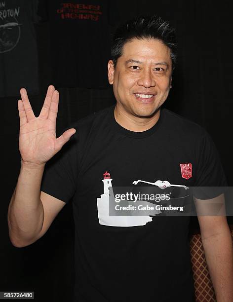 Actor Garret Wang extends his arm with a "live long and prosper" gesture from the "Star Trek" television franchise during the 15th annual official...