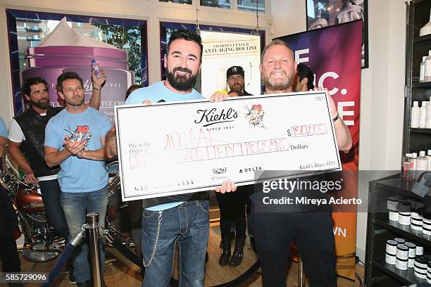 And president of Kiehl's, Chris Salgardo and CEO of amfAR, Kevin Robert Frost attend the 7th Annual LifeRide for amfAR at Kiehl's Since 1851 Flagship...