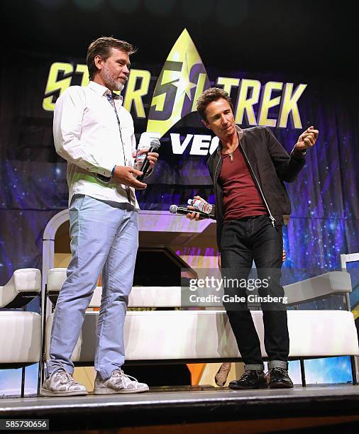 Actors Connor Trinneer watches Dominic Keating dance during the "A Look at Enterprise" panel at the 15th annual official Star Trek convention at the...