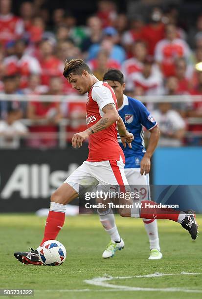 Granit Xhaka of MLS All-Stars FC dribbles the ball in front of Mauro Diaz of MLS All-Stars during the second half of the AT&T MLS All-Star Game at...