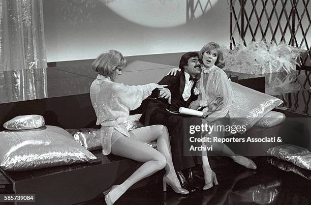 The twin sisters and famous German variety showgirls Alice and Ellen Kessler in the TV show 'Settimo anno' with Italian actor Lando Buzzanca . They...