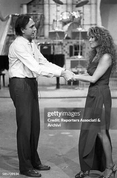 Italian TV host Pippo Baudo with Alida Chelli , Italian singer and actress, during the rehearsals for a TV show. Italy, 1975