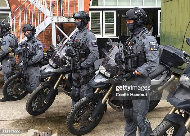 In this handout image supplied by the Metropolitan Police, members of the Met Police's elite counter-terror firearms unit are presented to the media...