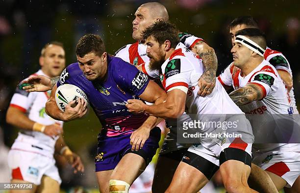 Lachlan Maranta of the Broncos is tackled during the round 22 NRL match between the St George Illawarra Dragons and the Brisbane Bronocs at WIN...