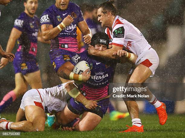 Jarrod Wallace of the Broncos is tackled during the round 22 NRL match between the St George Illawarra Dragons and the Brisbane Bronocs at WIN...