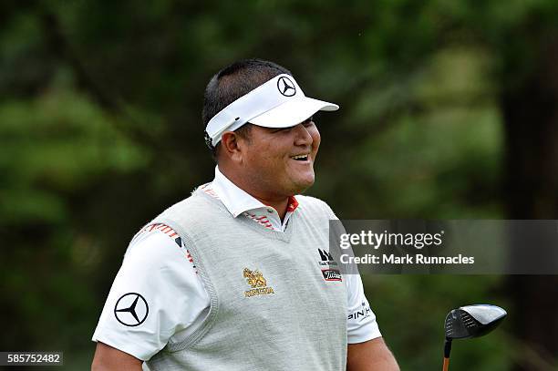 Prom Meesawat of Thailand walks from the tee on hole 2 with a big smile on day one of the Aberdeen Asset Management Paul Lawrie Matchplay at...