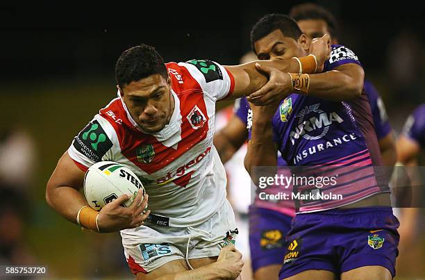 Taane Milne of the Dragons is tackled during the round 22 NRL match between the St George Illawarra Dragons and the Brisbane Bronocs at WIN Stadium...