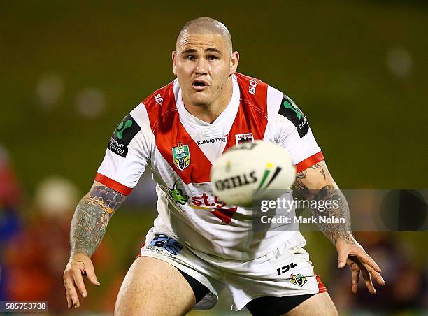 Russell Packer of the Dragons passes during the round 22 NRL match between the St George Illawarra Dragons and the Brisbane Bronocs at WIN Stadium on...