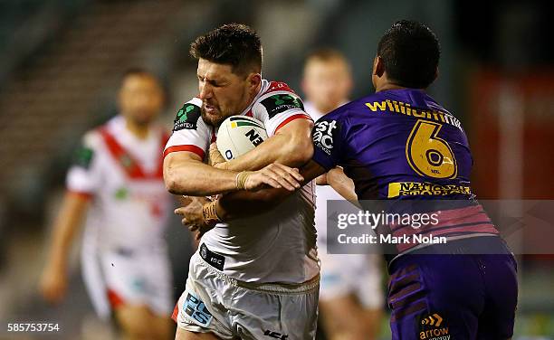 Gareth Widdop of the Dragons is tackled during the round 22 NRL match between the St George Illawarra Dragons and the Brisbane Bronocs at WIN Stadium...