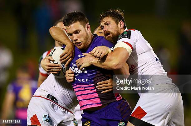 Thomas Opacic of the Broncos is atckeld during the round 22 NRL match between the St George Illawarra Dragons and the Brisbane Bronocs at WIN Stadium...