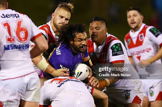 Adam Blair of the Broncos is tackled during the round 22 NRL match between the St George Illawarra Dragons and the Brisbane Bronocs at WIN Stadium on...