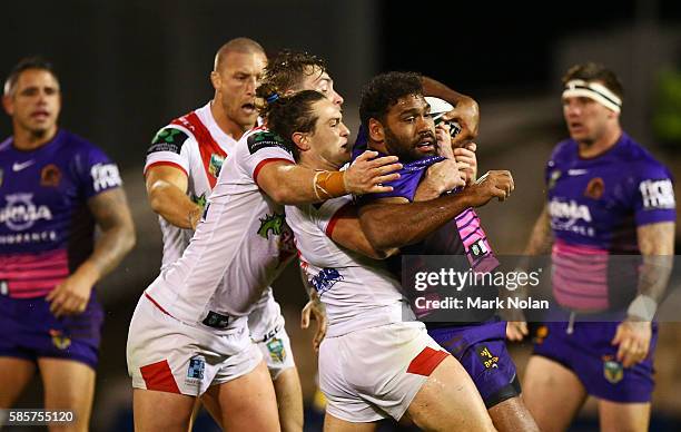 Sam Thaiday of the Broncos is tackled during the round 22 NRL match between the St George Illawarra Dragons and the Brisbane Bronocs at WIN Stadium...