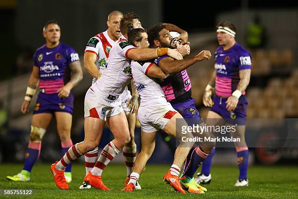 Sam Thaiday of the Broncos is tackled during the round 22 NRL match between the St George Illawarra Dragons and the Brisbane Bronocs at WIN Stadium...