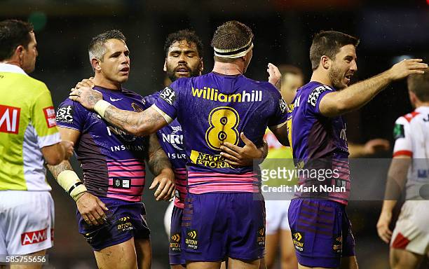 Broncos players celebrate winning the round 22 NRL match between the St George Illawarra Dragons and the Brisbane Bronocs at WIN Stadium on August 4,...
