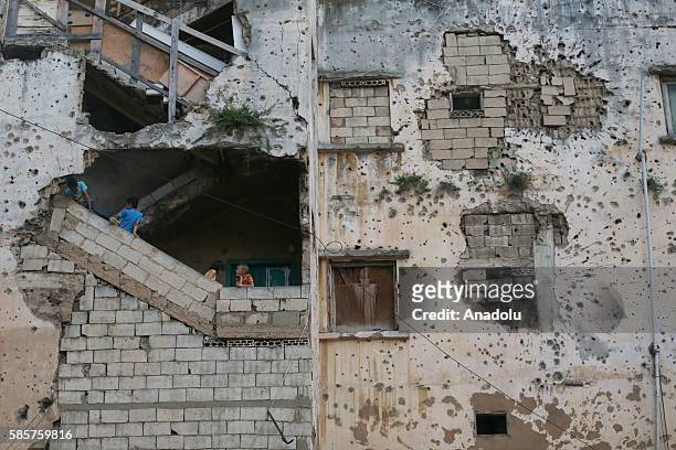 Syrian refugee children who have been forced to leave their homes due to the ongoing war, are seen inside the abandoned buildings in Beirut, Lebanon...