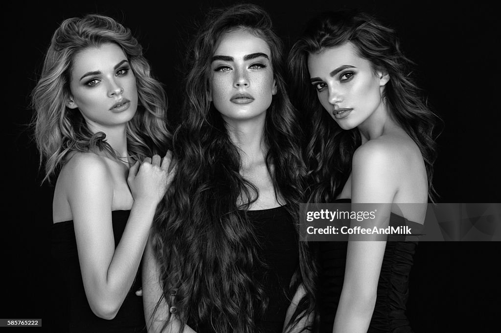 Three beautiful girls with perfect hair and make-up