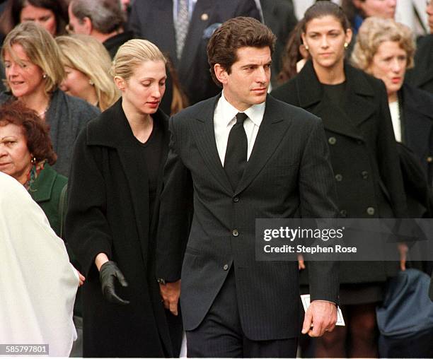 John F. Kennedy Jr. With his wife Carolyn after Michael Kennedy's funeral, Massachusetts, 1/3/98.