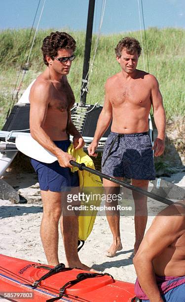 John F. Kennedy Jr. And his cousin Robert F. Kennedy, Jr. Prepare to go kayaking at the compound in Hyannis, Port Sunday 8/24/97.