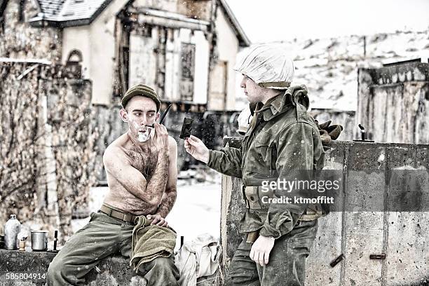wwii gi shaving in front of a bombed building - straight razor stock pictures, royalty-free photos & images