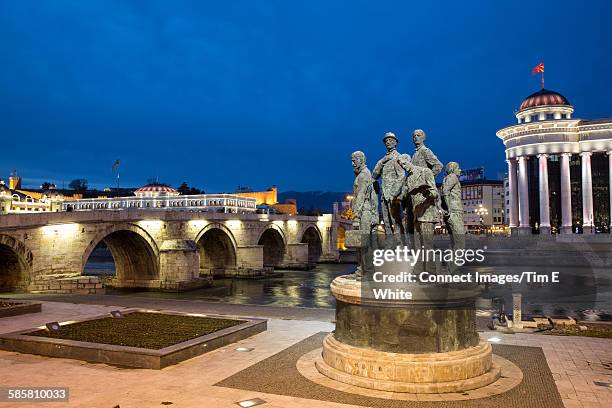 old town bridge and cityscape at night, skopje, macedonia - skopje stock pictures, royalty-free photos & images