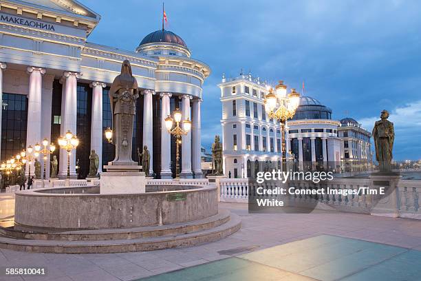 view of statues and national archaeological museum at dusk, skopje, macedonia - skopje stock pictures, royalty-free photos & images