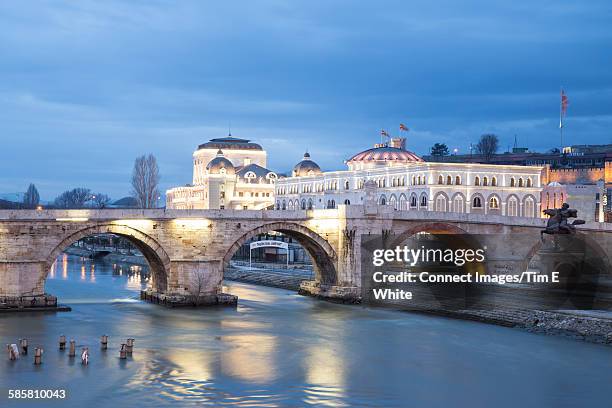 old town bridge and cityscape at dusk, skopje, macedonia - skopje stock pictures, royalty-free photos & images