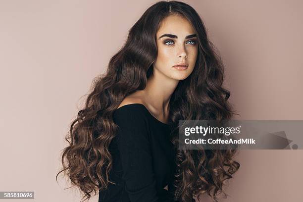 studio shot of young beautiful woman - high fashion hair stock pictures, royalty-free photos & images