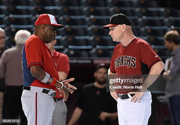 Manager Dusty Baker of the Washington Nationals talks with third base coach Matt Williams of the Arizona Diamondbacks during batting practice prior...