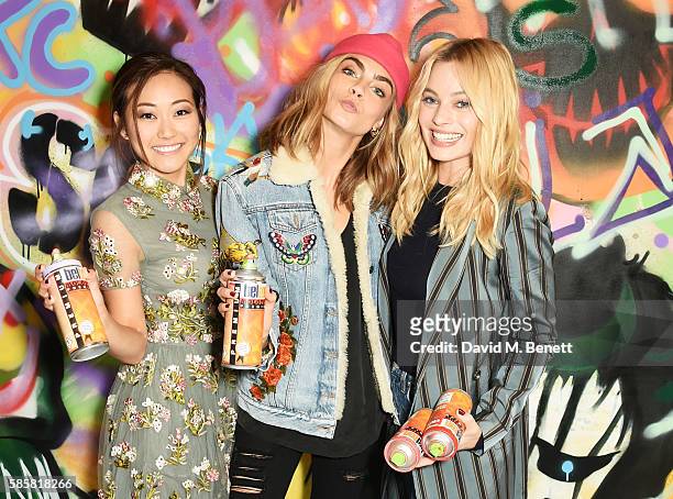 Karen Fukuhara, Cara Delevingne, Margot Robbie and the cast of "Suicide Squad" put the finishing touches on Graffiti artist Ryan Meades' mural ahead...