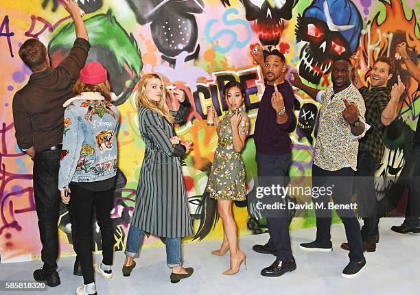 Joel Kinnaman, Cara Delevingne, Margot Robbie, Karen Fukuhara, Will Smith, Adewale Akinnuoye-Agbaje, Jai Courtney and the cast of "Suicide Squad" put...