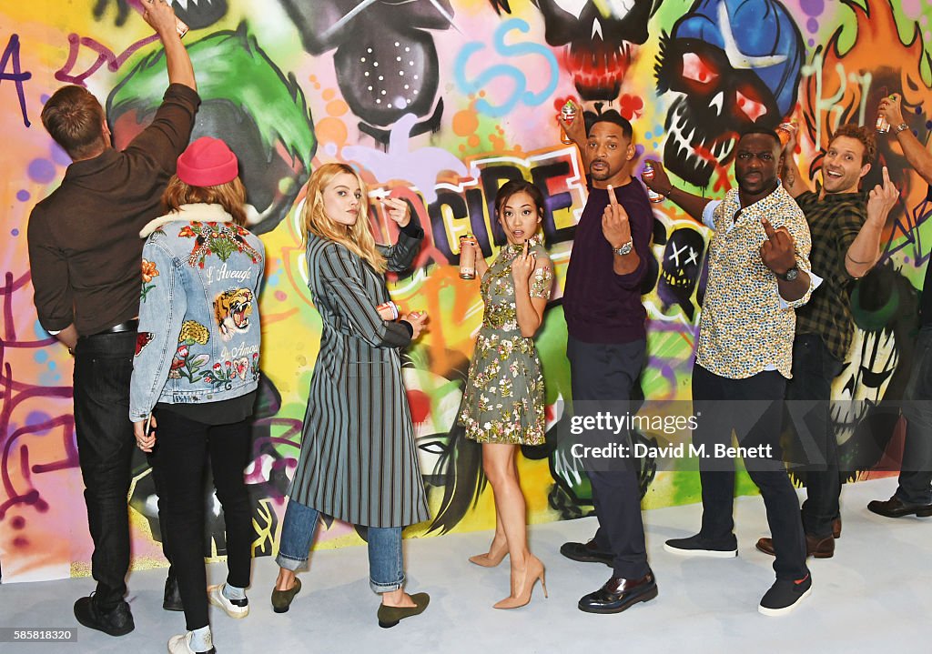 The Cast of "Suicide Squad" Add The Finishing Touches To Graffiti Artist Ryan Meades' Mural In London