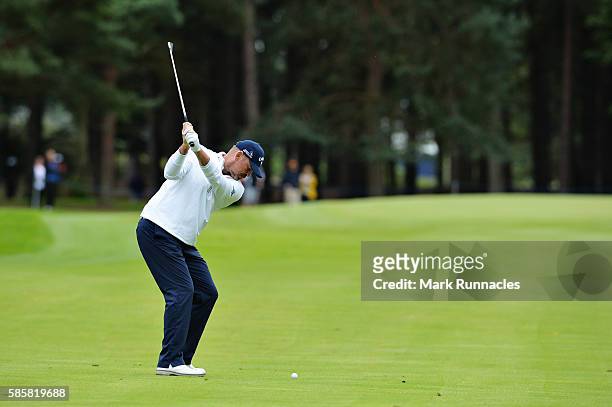 Thomas Bjorn of Denmark takes his second shot on hole 7 on day one of the Aberdeen Asset Management Paul Lawrie Matchplay at Archerfield Links Golf...
