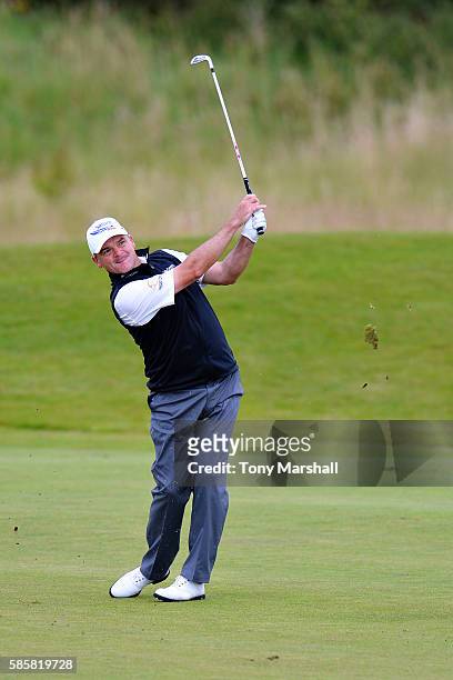 Paul Lawrie of Scotland takes his second shot on hole 15 on day one of the Aberdeen Asset Management Paul Lawrie Matchplay at Archerfield Links Golf...