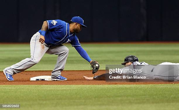 Second baseman Christian Colon of the Kansas City Royals catches Brad Miller of the Tampa Bay Rays attempting to steal second base during the second...