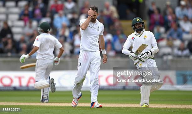James Anderson of England reacts as Younis Khan and Azhar Ali of Pakistan score runs during day two of the 3rd Investec Test between England and...