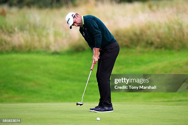 Richard Bland of England takes his putt on the green at hole 17 on day one of the Aberdeen Asset Management Paul Lawrie Matchplay at Archerfield...