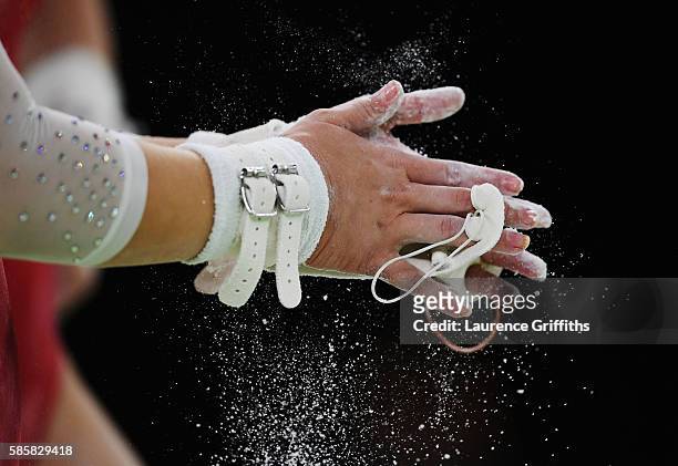 Detail as a Russian gymnast applies chalk during an artistic gymnastics training session on August 4, 2016 at the Arena Olimpica do Rio in Rio de...