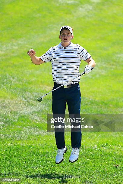 Bud Cauley of the United States reacts to his shot on the 18th hole during the first round of the travelers Championship at TPC River Highlands on...