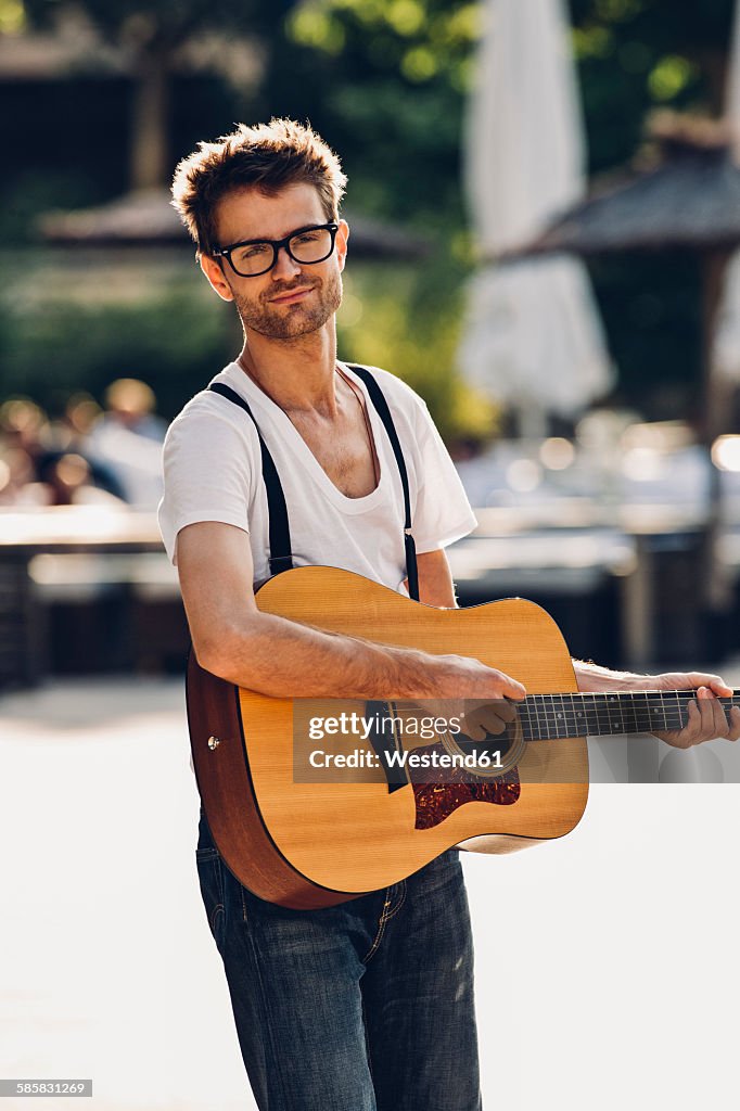 Portrait of young man with guitar