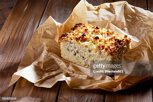 home-baked potato cake with bacon on baking paper - potato cake stock pictures, royalty-free photos & images