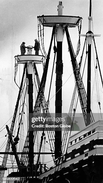 Plimoth Plantation workers Paul Di Sallatone and Walker Keeman take down the mast from the Mayflower II in Plymouth Harbor in Plymouth, Mass., on...