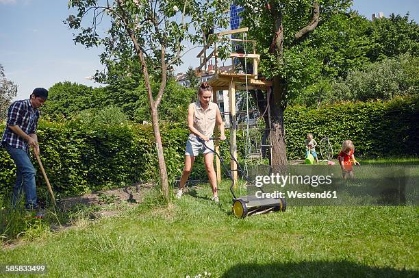 family gardening - lawnmowing stock pictures, royalty-free photos & images